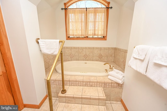 bathroom featuring tiled tub and tile patterned floors