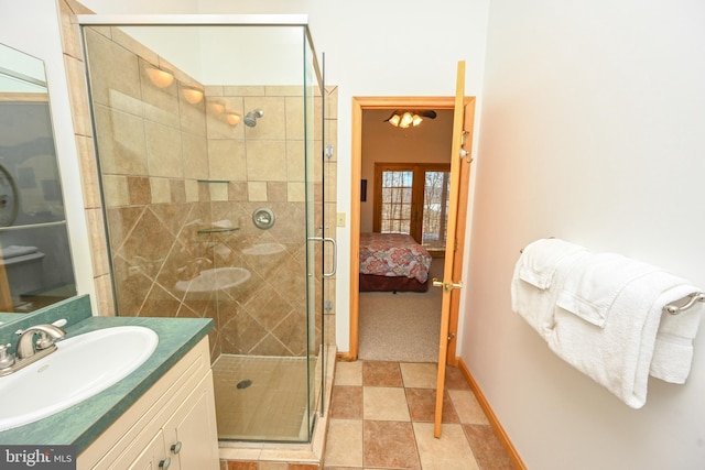 bathroom with french doors, vanity, and walk in shower