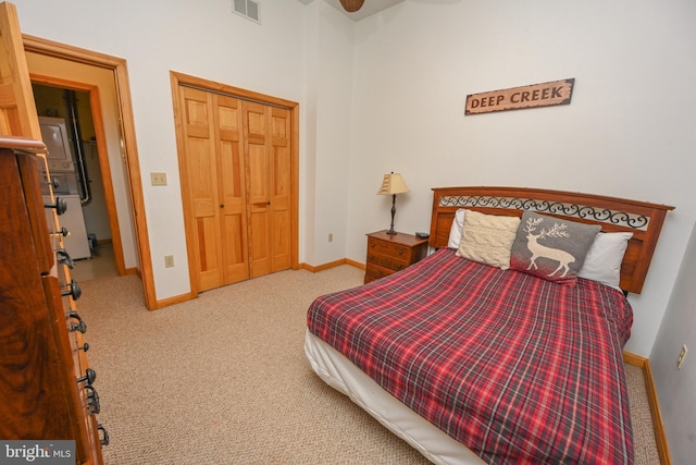 carpeted bedroom with a closet