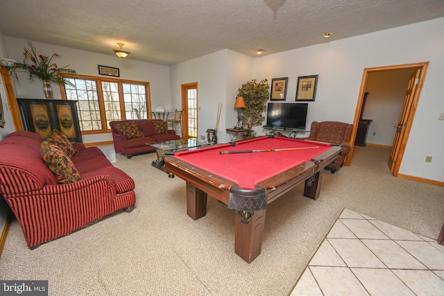 rec room with light colored carpet, a textured ceiling, and billiards