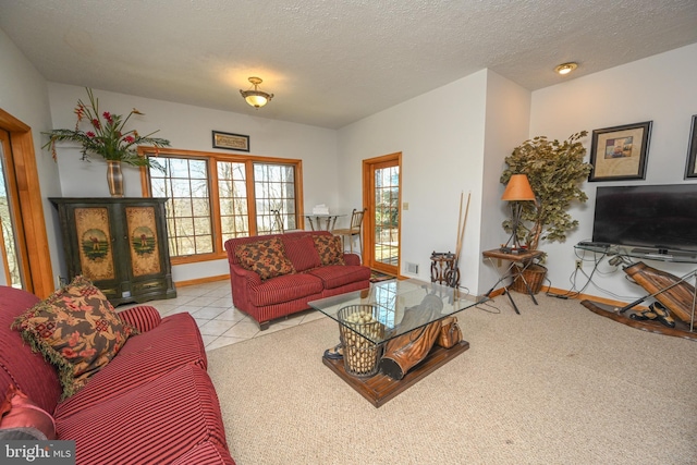 living room with light tile patterned floors and a textured ceiling