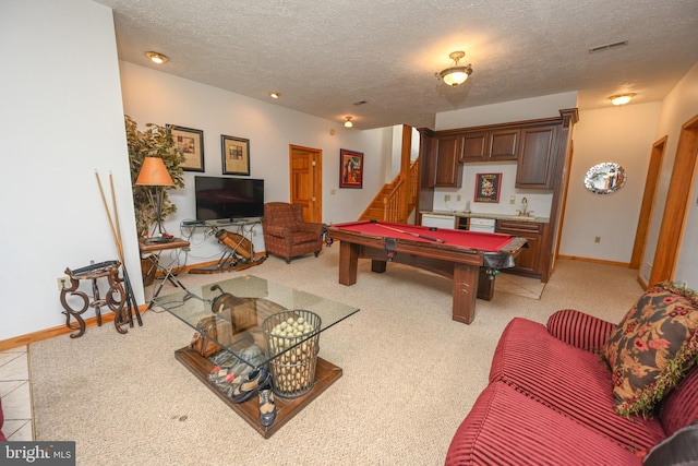 rec room featuring indoor bar, light carpet, a textured ceiling, and billiards