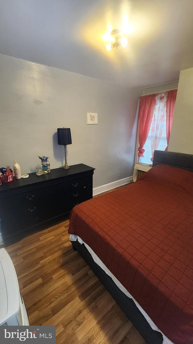 bedroom featuring wood-type flooring