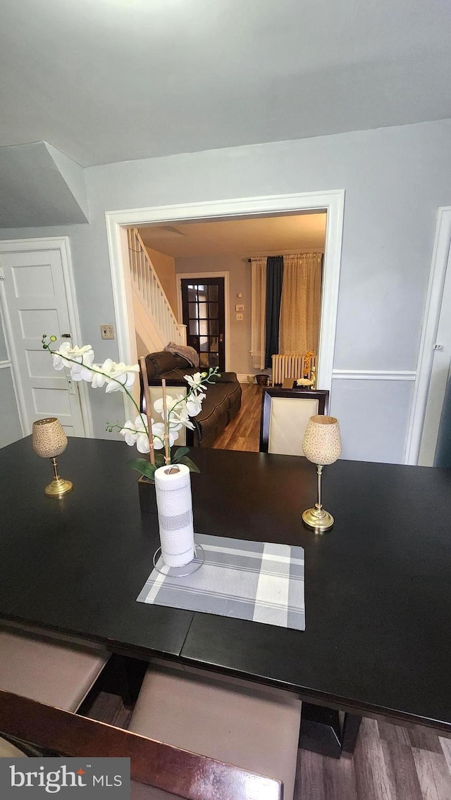 dining room with hardwood / wood-style flooring