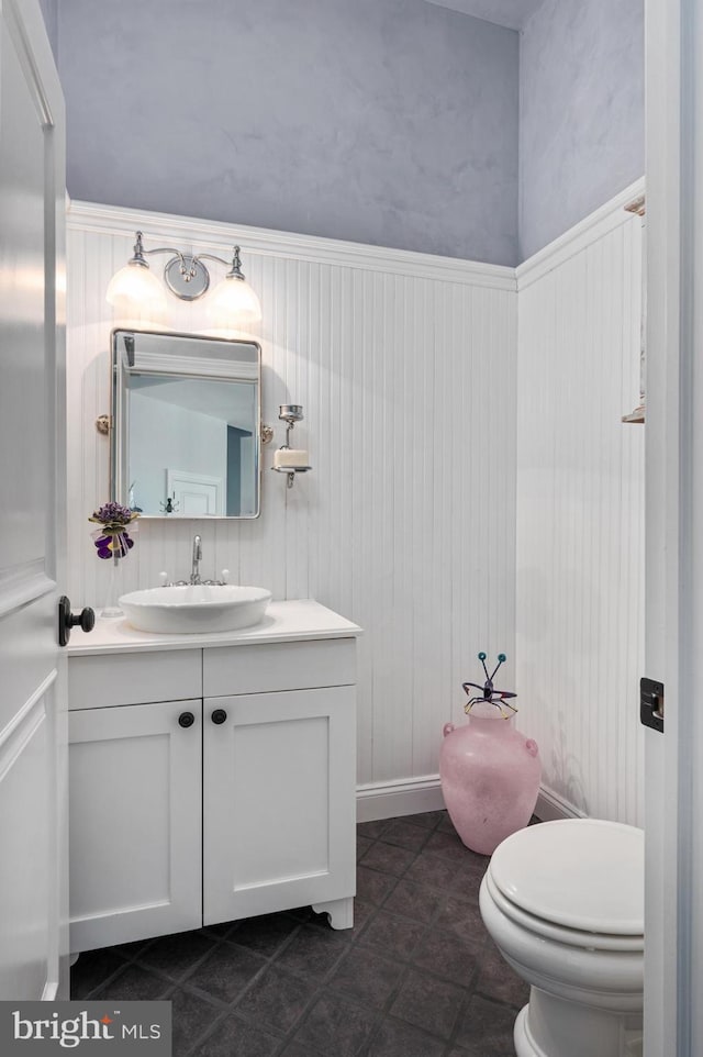 bathroom with vanity, tile patterned floors, and toilet