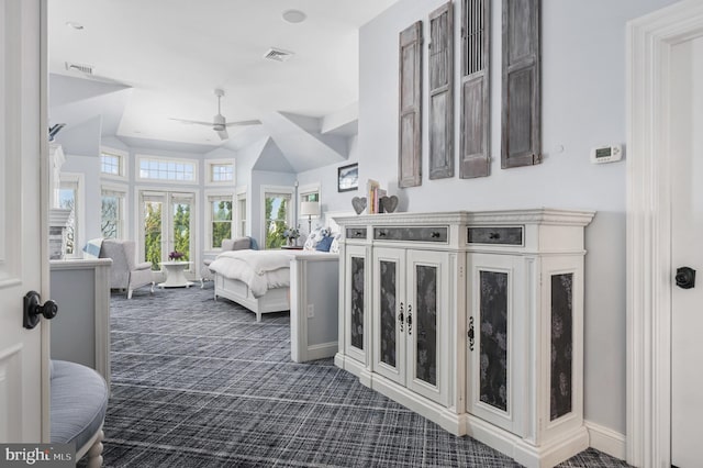 carpeted bedroom featuring lofted ceiling