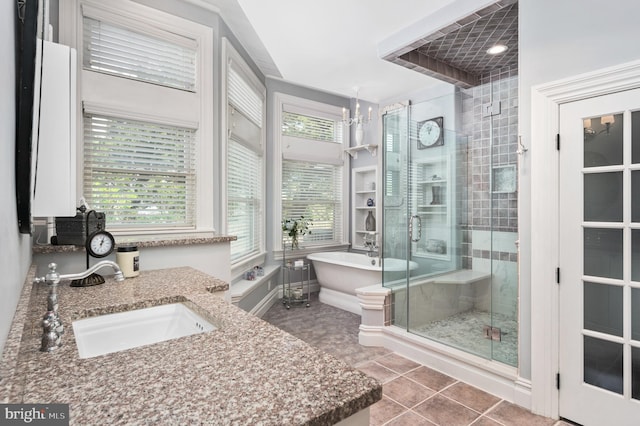 bathroom with vanity, a notable chandelier, tile patterned floors, and separate shower and tub