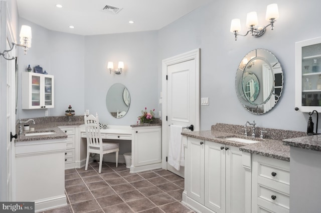 bathroom with tile patterned flooring and vanity