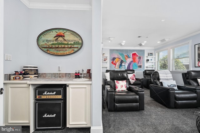 bar with white cabinetry, sink, and crown molding