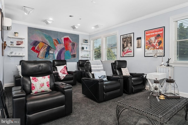 home theater room featuring crown molding, an AC wall unit, and dark carpet