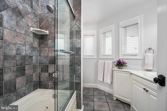 bathroom featuring tile patterned floors, vanity, and shower / bath combination with glass door