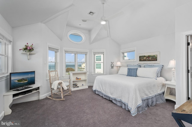 bedroom with ceiling fan, high vaulted ceiling, and dark carpet