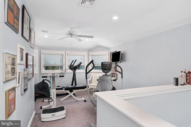 workout area featuring lofted ceiling, ceiling fan, and carpet