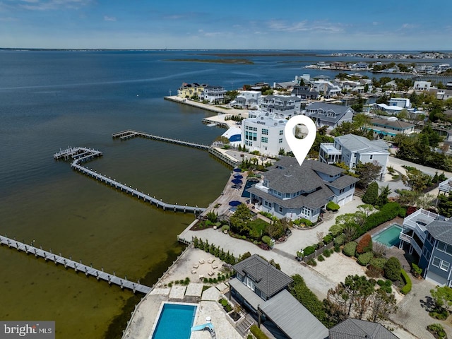 drone / aerial view with a water view