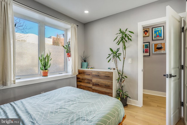 bedroom with light hardwood / wood-style flooring