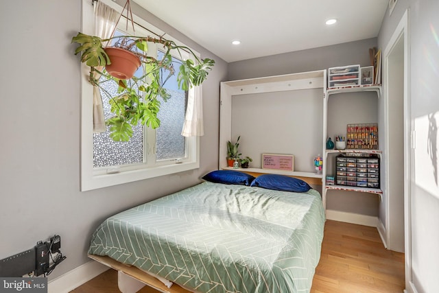 bedroom featuring wood-type flooring