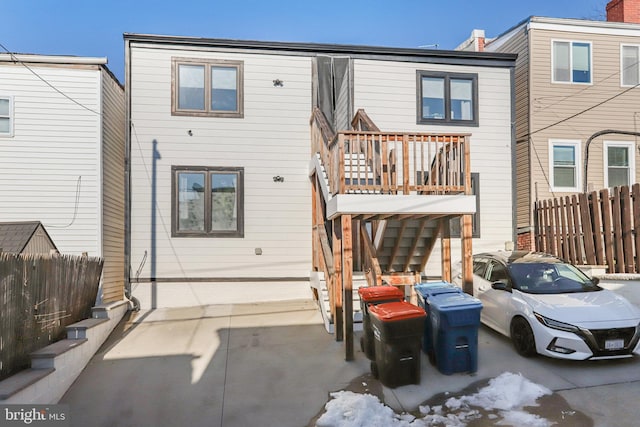 back of property with a balcony