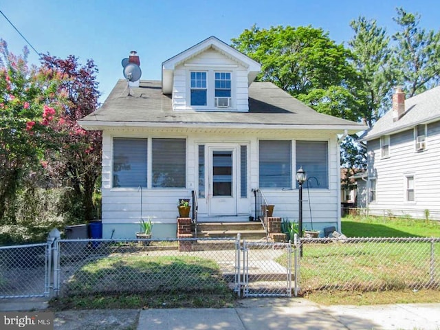 bungalow-style house with a front yard