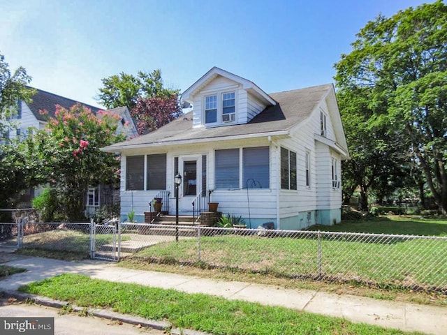 bungalow-style house with a front yard