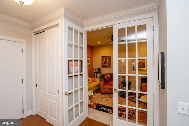 doorway to outside featuring ornamental molding and french doors