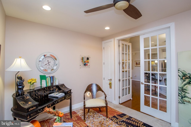 office with ceiling fan and french doors