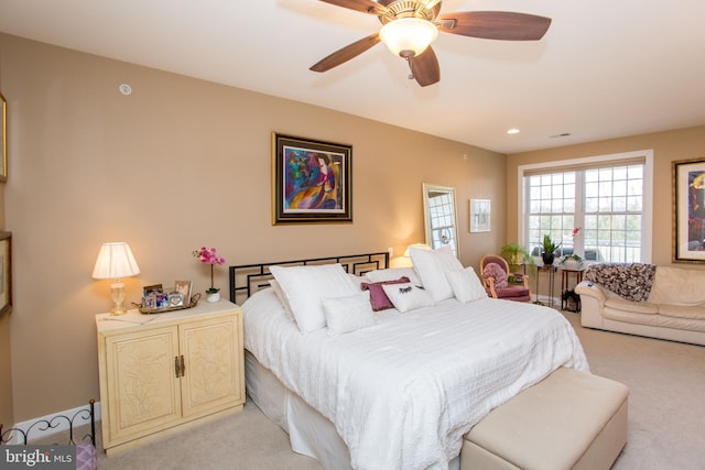 carpeted bedroom with ceiling fan