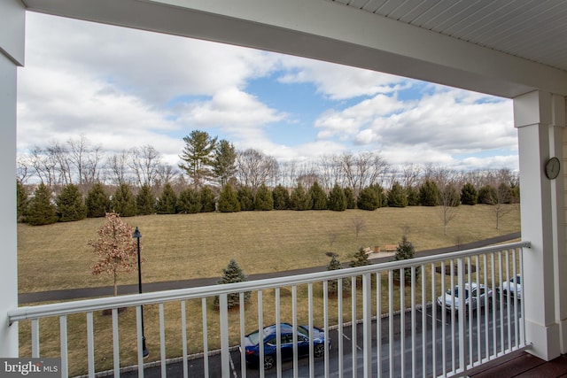 balcony featuring a rural view