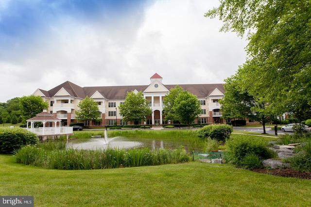 view of front facade with a gazebo and a front yard