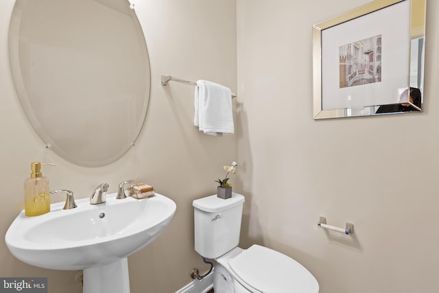 bathroom with sink and toilet