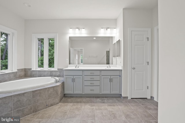 14496 Aurora Dr, Woodbridge, VA 22193 - bathroom featuring healthy amount of natural light, double vanity, a garden tub, and tile patterned flooring