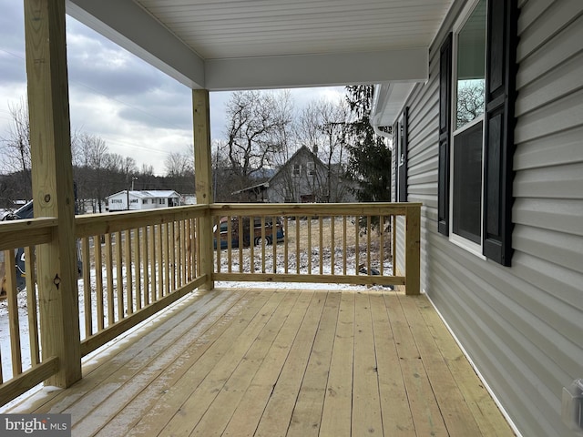 view of snow covered deck