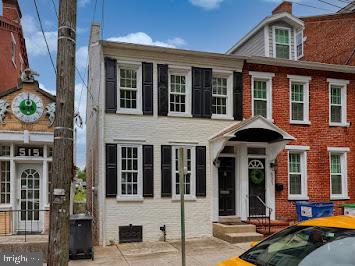 519 Locust St, Columbia, PA 17512 - view of front of property featuring a chimney and brick siding