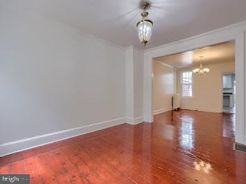519 Locust St, Columbia, PA 17512 - unfurnished room with a chandelier, ornamental molding, baseboards, and wood finished floors