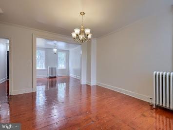 519 Locust St, Columbia, PA 17512 - empty room with radiator, crown molding, a chandelier, wood finished floors, and baseboards