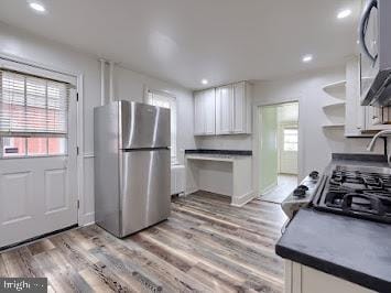 519 Locust St, Columbia, PA 17512 - kitchen with freestanding refrigerator, white cabinets, plenty of natural light, open shelves, and recessed lighting