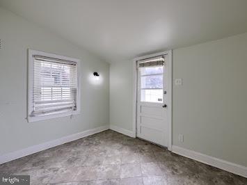 519 Locust St, Columbia, PA 17512 - spare room featuring lofted ceiling and baseboards
