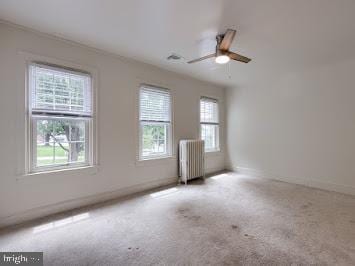 519 Locust St, Columbia, PA 17512 - unfurnished room featuring radiator, ceiling fan, carpet floors, and baseboards