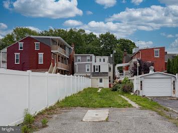 519 Locust St, Columbia, PA 17512 - view of yard with an outdoor structure, a garage, and driveway