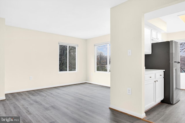 unfurnished living room featuring light hardwood / wood-style flooring