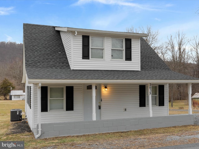 view of front of property featuring a porch and central AC unit