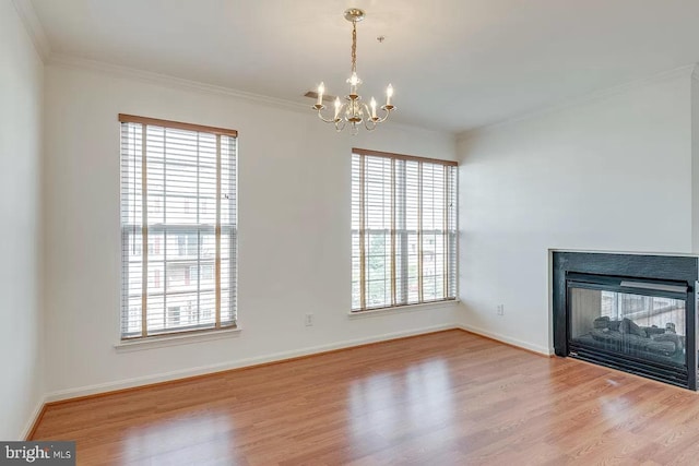 unfurnished living room with hardwood / wood-style floors, crown molding, and a multi sided fireplace