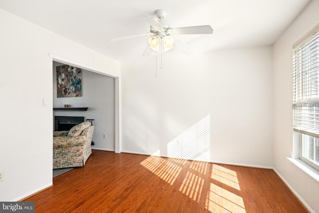 empty room featuring hardwood / wood-style flooring and ceiling fan