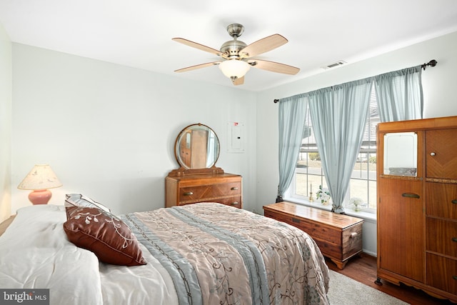 bedroom featuring hardwood / wood-style flooring and ceiling fan