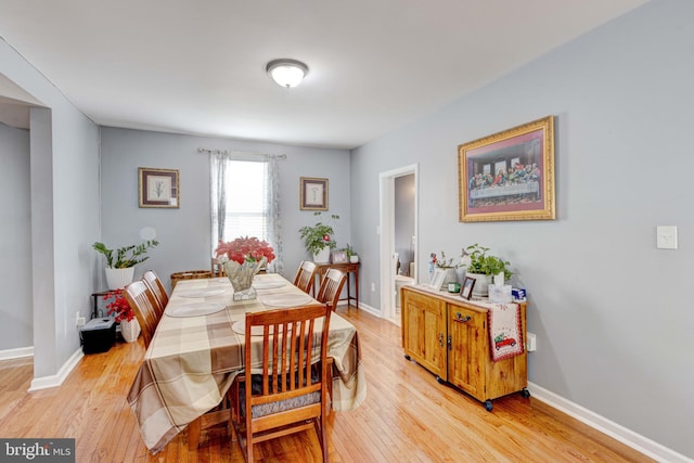 dining area featuring light wood-type flooring