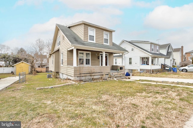 view of front of home featuring covered porch and a front lawn