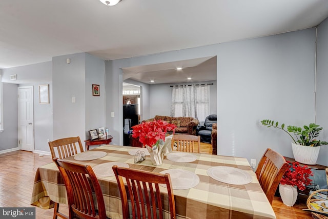 dining area featuring wood-type flooring