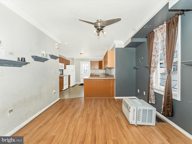 kitchen featuring white appliances, ornamental molding, and light hardwood / wood-style floors