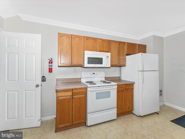 kitchen featuring crown molding and white appliances