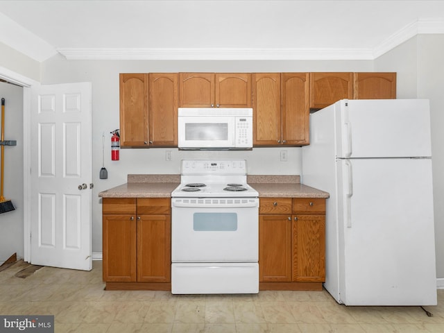 kitchen with crown molding and white appliances