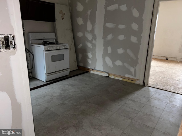 kitchen with white range with gas cooktop